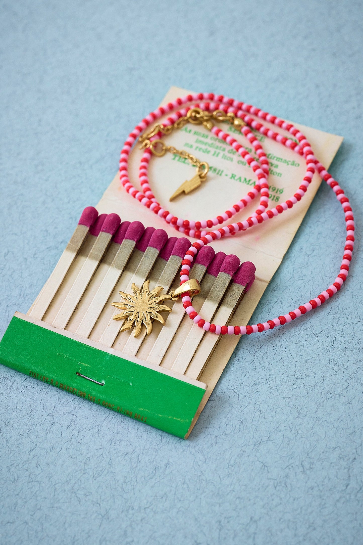 Red and Pink Bead Gold Sunstar Necklace