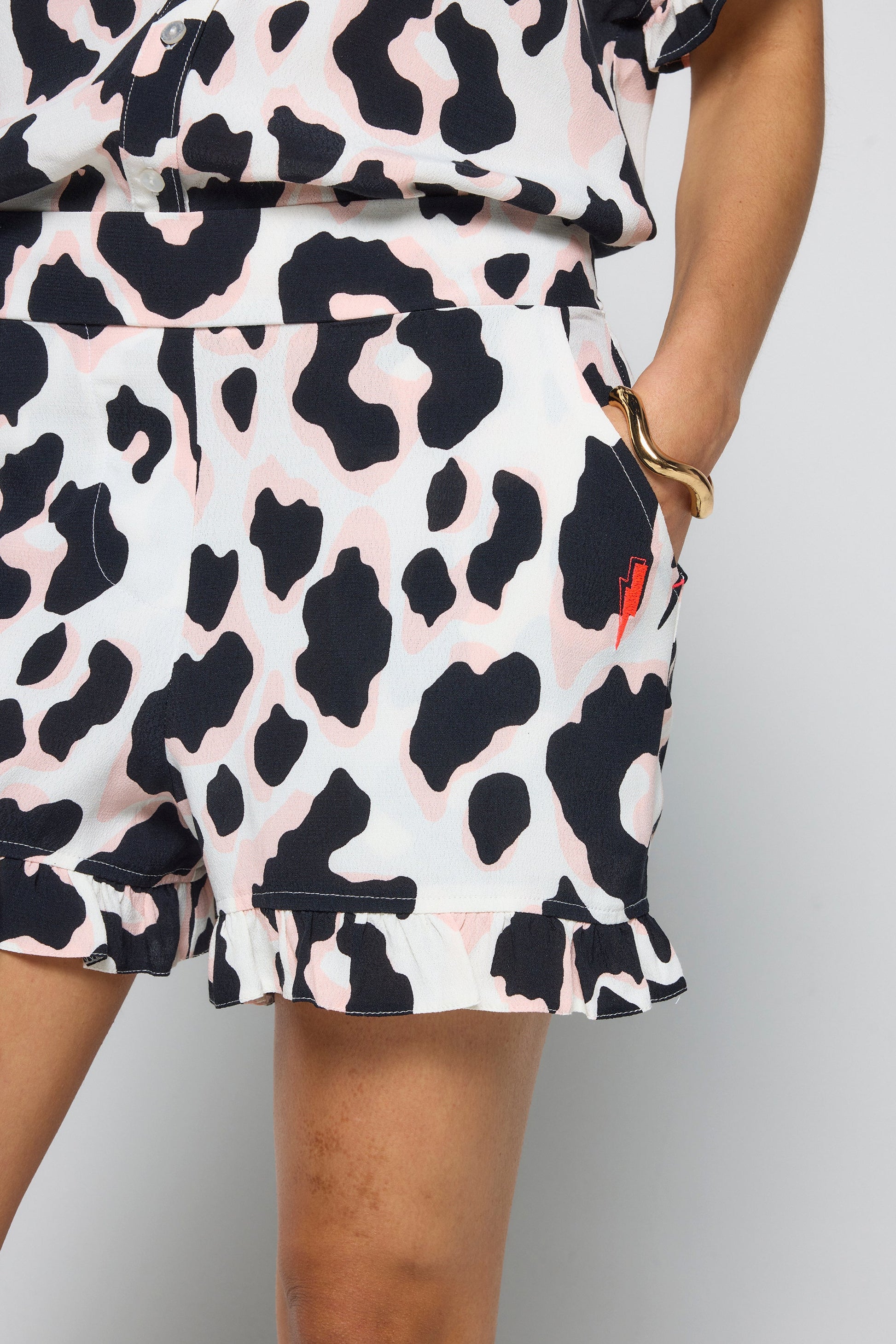 Ivory with Neutral and Black Leopard Frill Hem Shorts